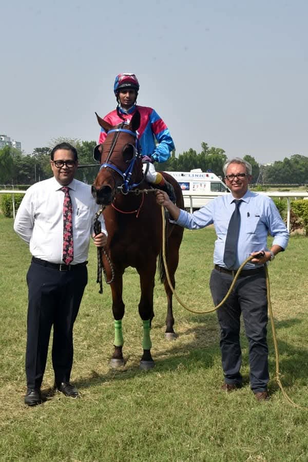 In the winner's enclosure with jockey and horse